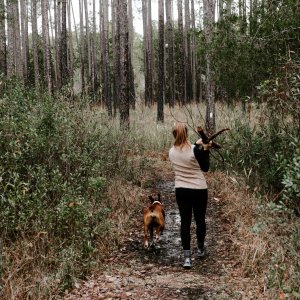 girl hiking with her dog